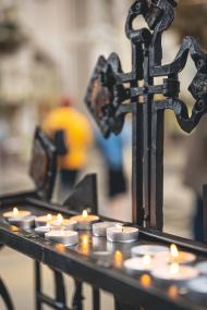 Lots of small candles in a catholic church.