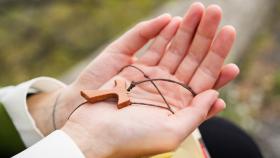 Woman's Hands Clasp Crucifix